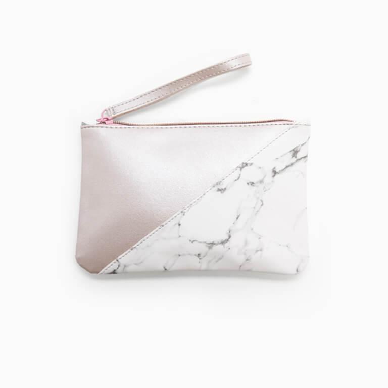 The January Glam Bag Plus design features a chic rose gold and marble pattern.