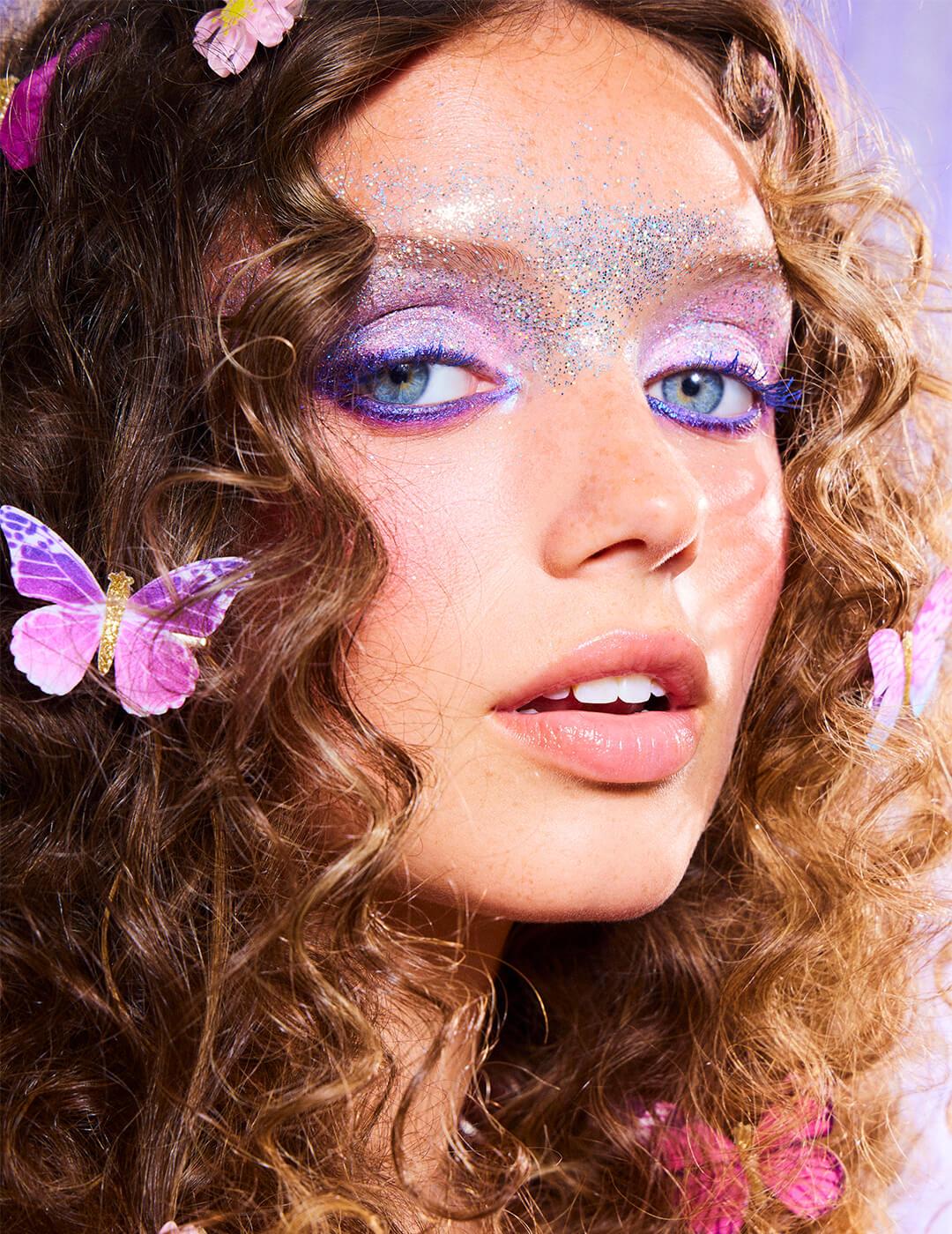 Close-up of a model in lilac fairy makeup look