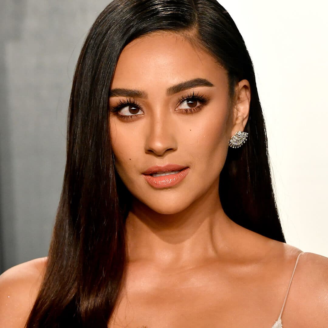 A photo of Shay Mitchell with her dark hair color