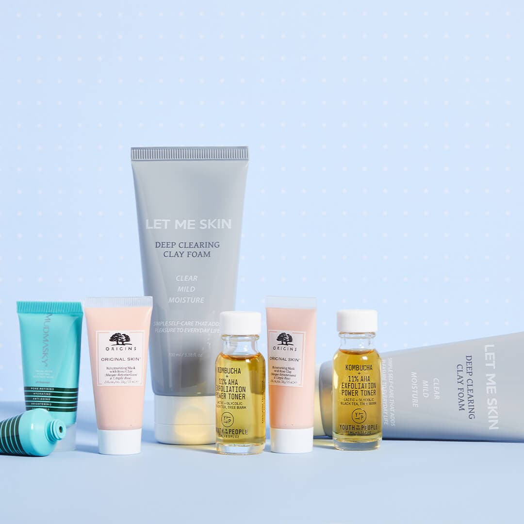 Image of skincare products of different formulas from various brands on light blue background