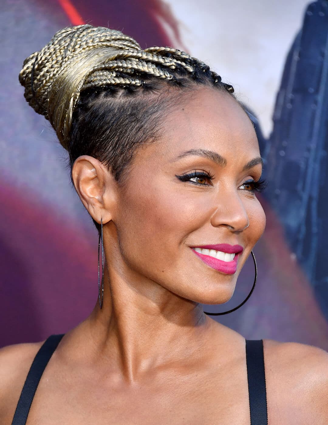 Jada Pinkett Smith rocking a braided bun and undercut hairstyle on the red carpet