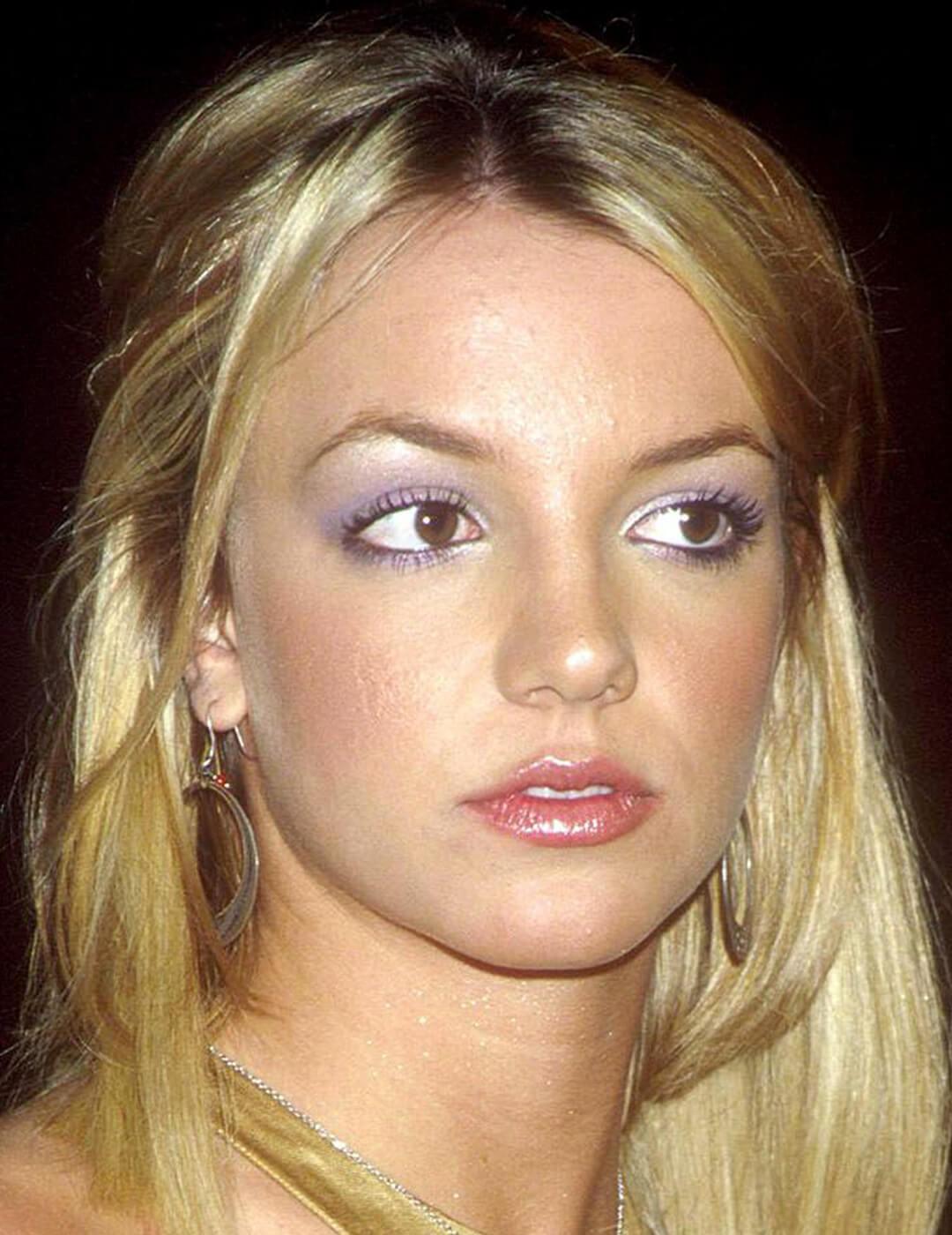Close-up of a younger Britney Spears rocking a shimmery lavender eyeshadow makeup look