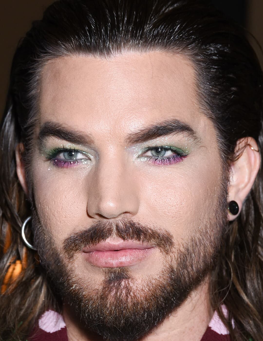 Close-up of Adam Lambert rocking a two-toned eyeliner makeup look