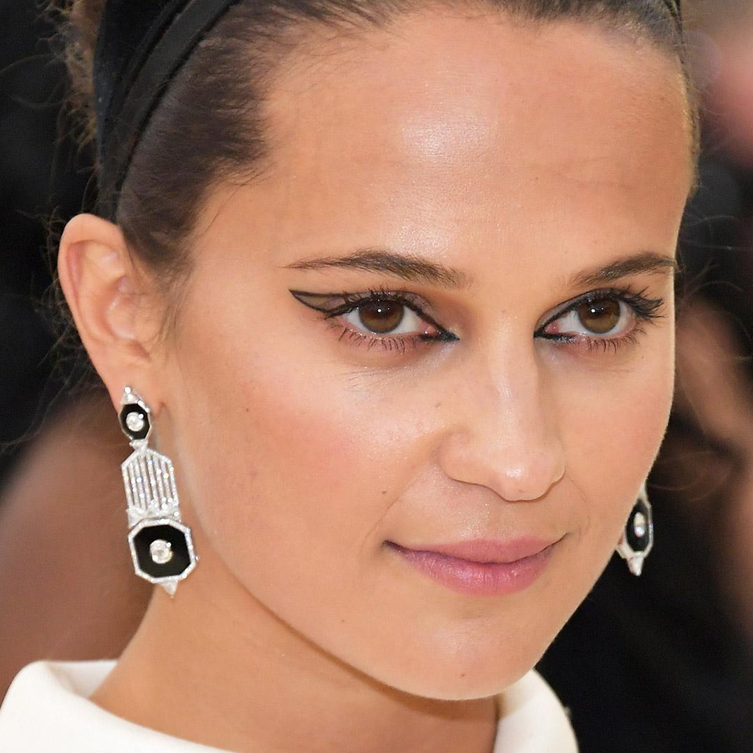 A photo of Alicia Vikander with a graphic eyeliner outline