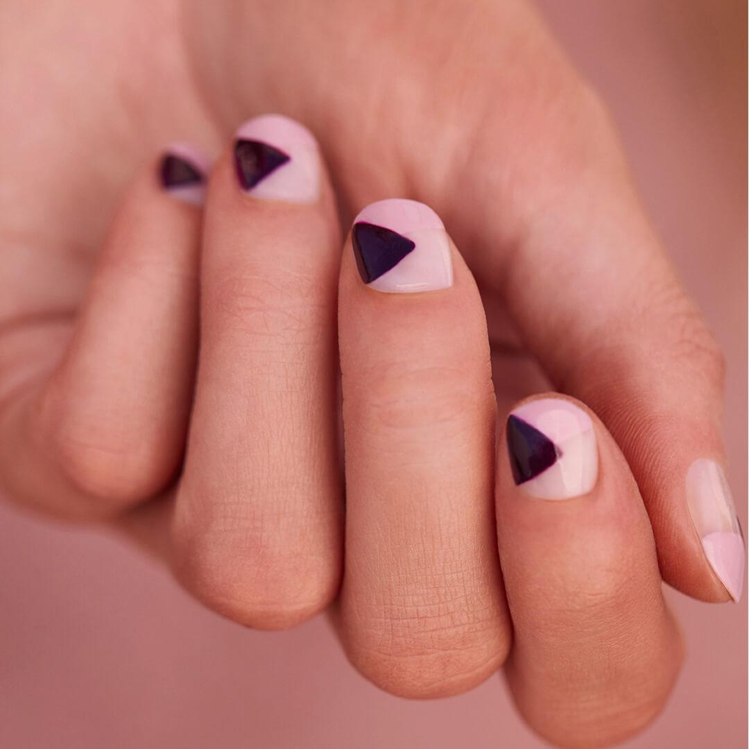 Image of woman's hand with geometric nail art