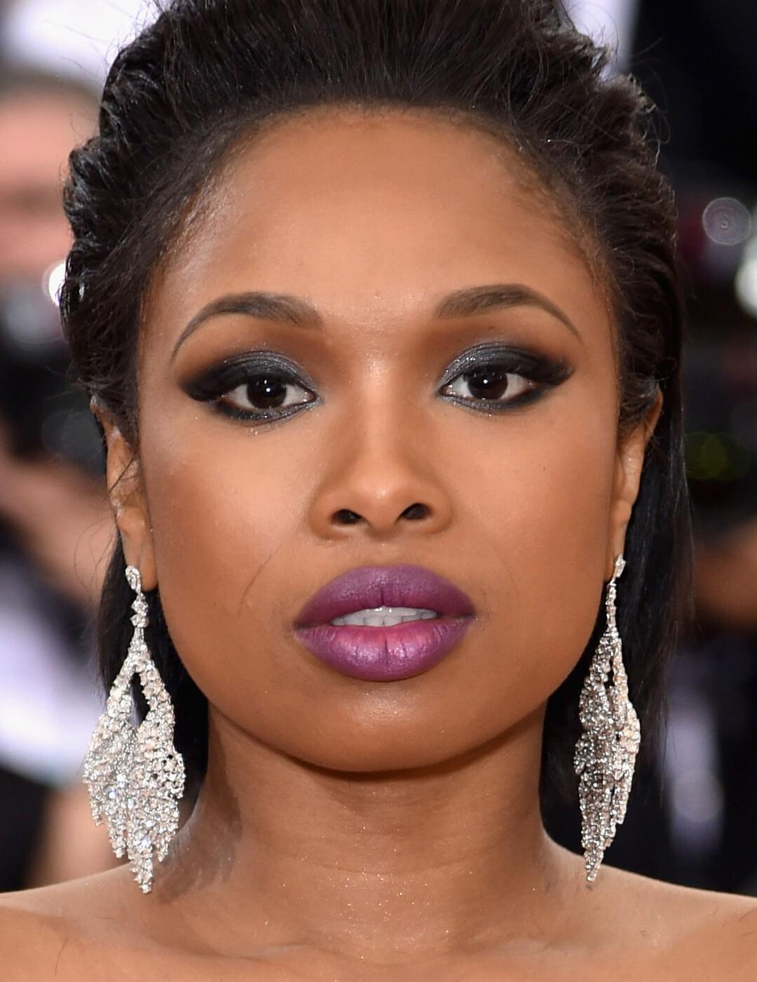 Jennifer Hudson rocking a black smoky eye makeup look paired with berry lips