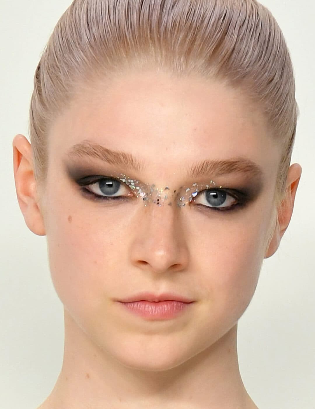 Close-up of Hunter Schafer rocking a separated cat eye with a broken glass eye makeup look
