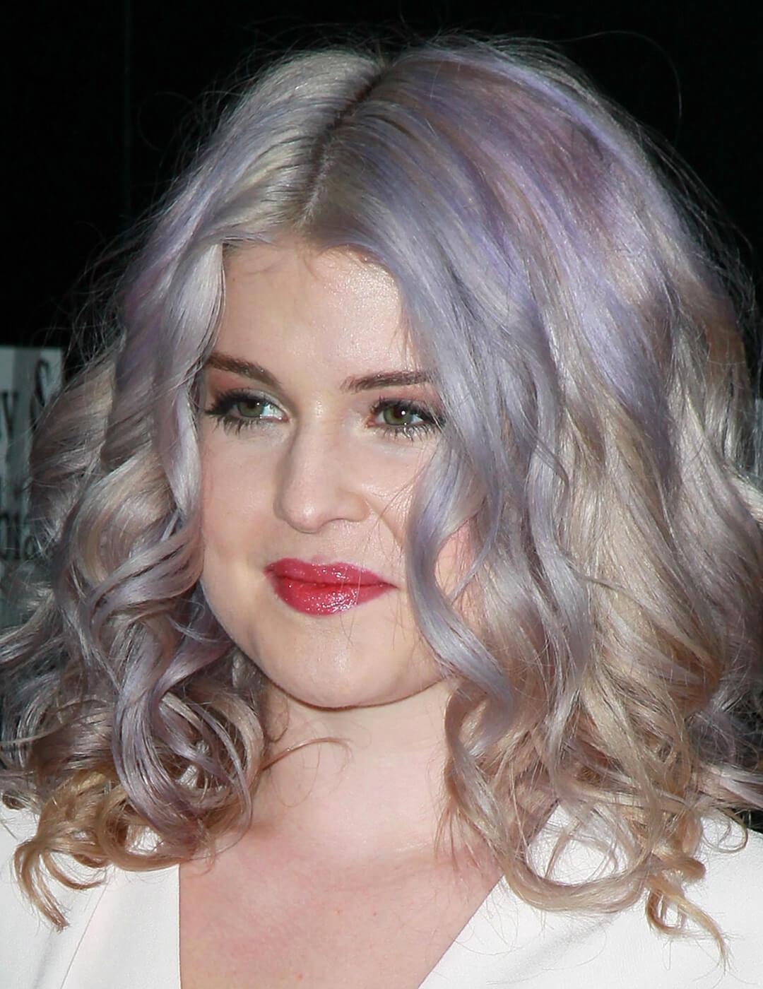 A photo of Kelly Osbourne deep silver with almost purple undertones hairstyle