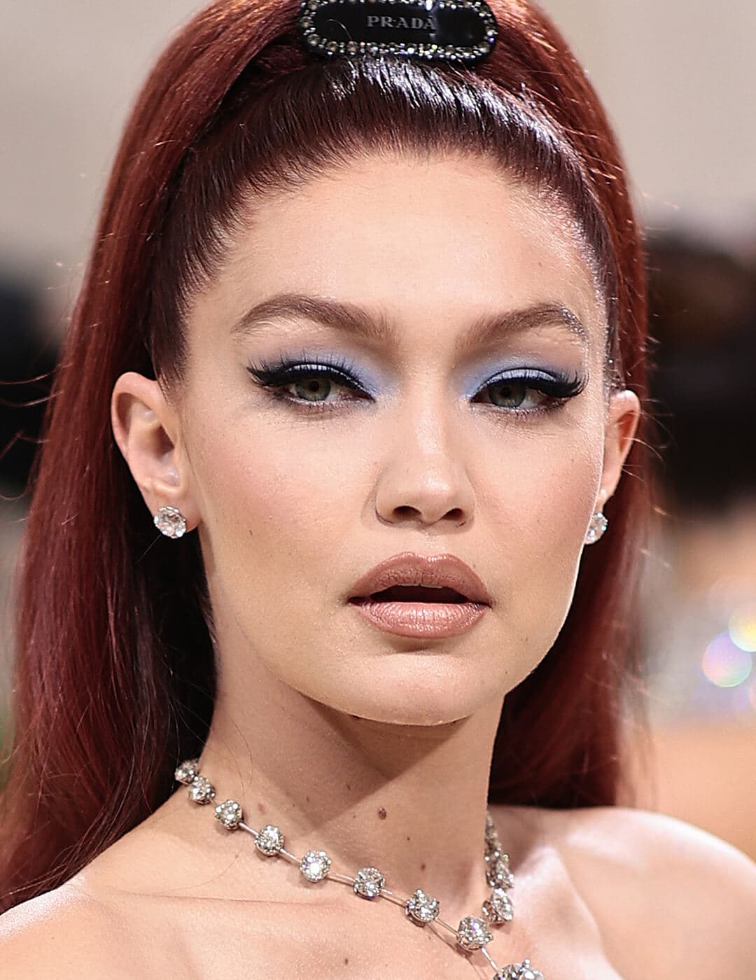 Gigi Hadid looking fierce in a matte light blue eyeshadow look and nude lips