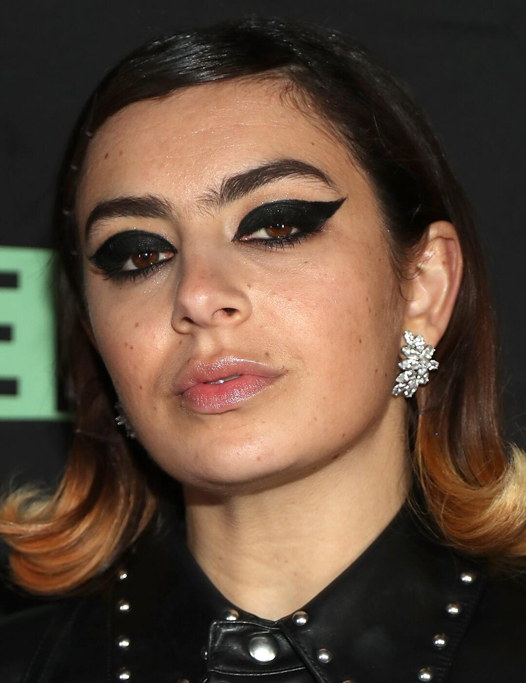 Charli XCX rocking a bold and thick cat eye makeup look