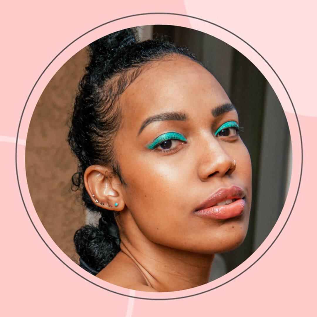Profile image of Bianca Alexander rocking a bold, green eyeliner makeup look in a pink border frame