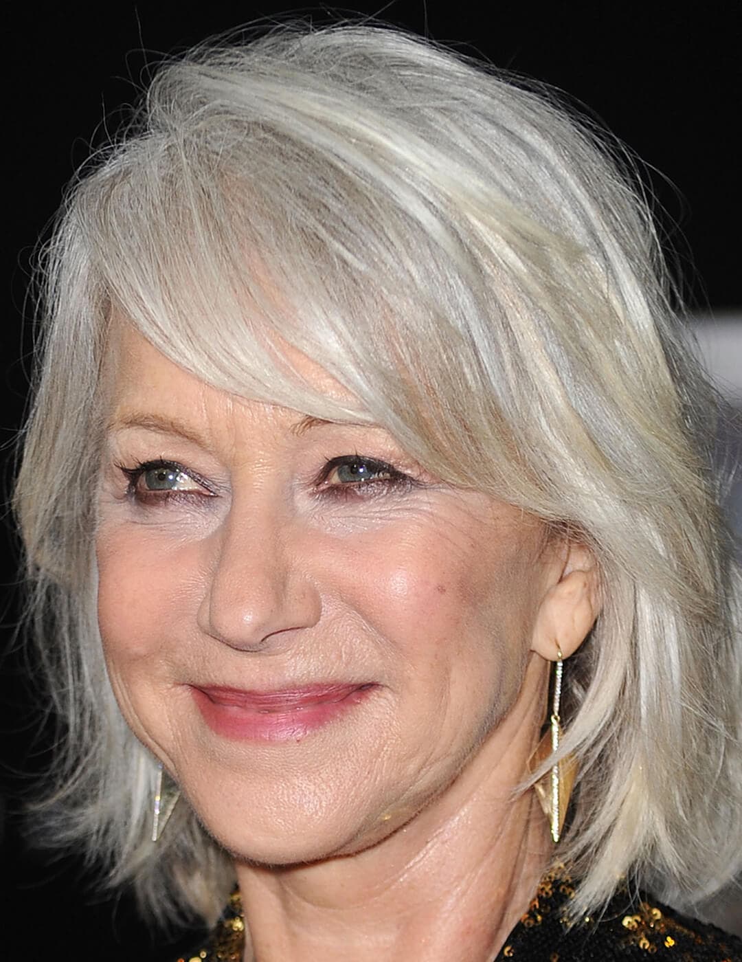 A photo of Dame Helen Mirren with a piecey long bob hairstyle
