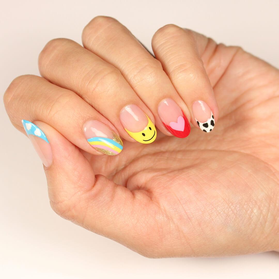 Close-up of model's hand with cute and colorful nail art