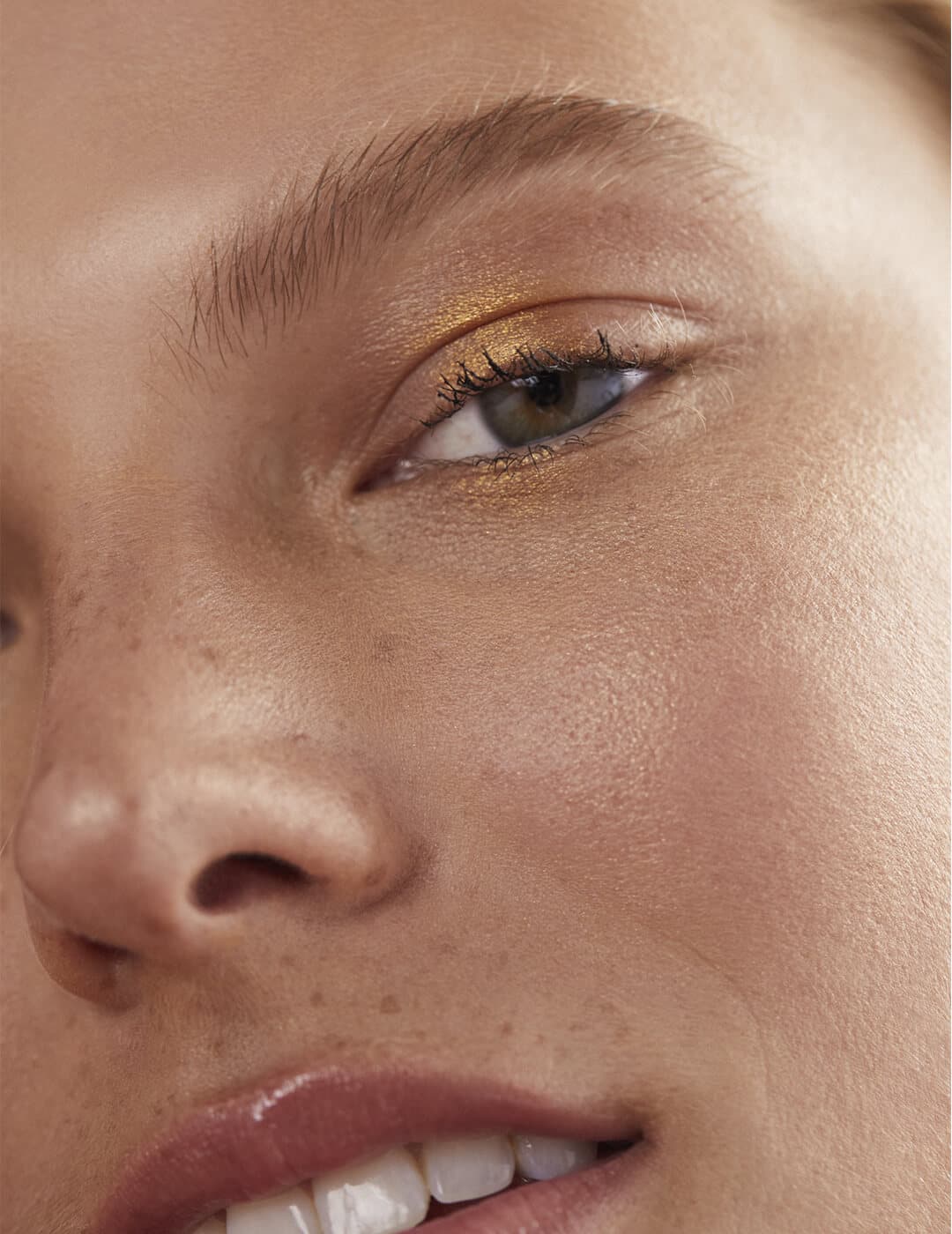 Close-up of a model's gold eyeshadow look