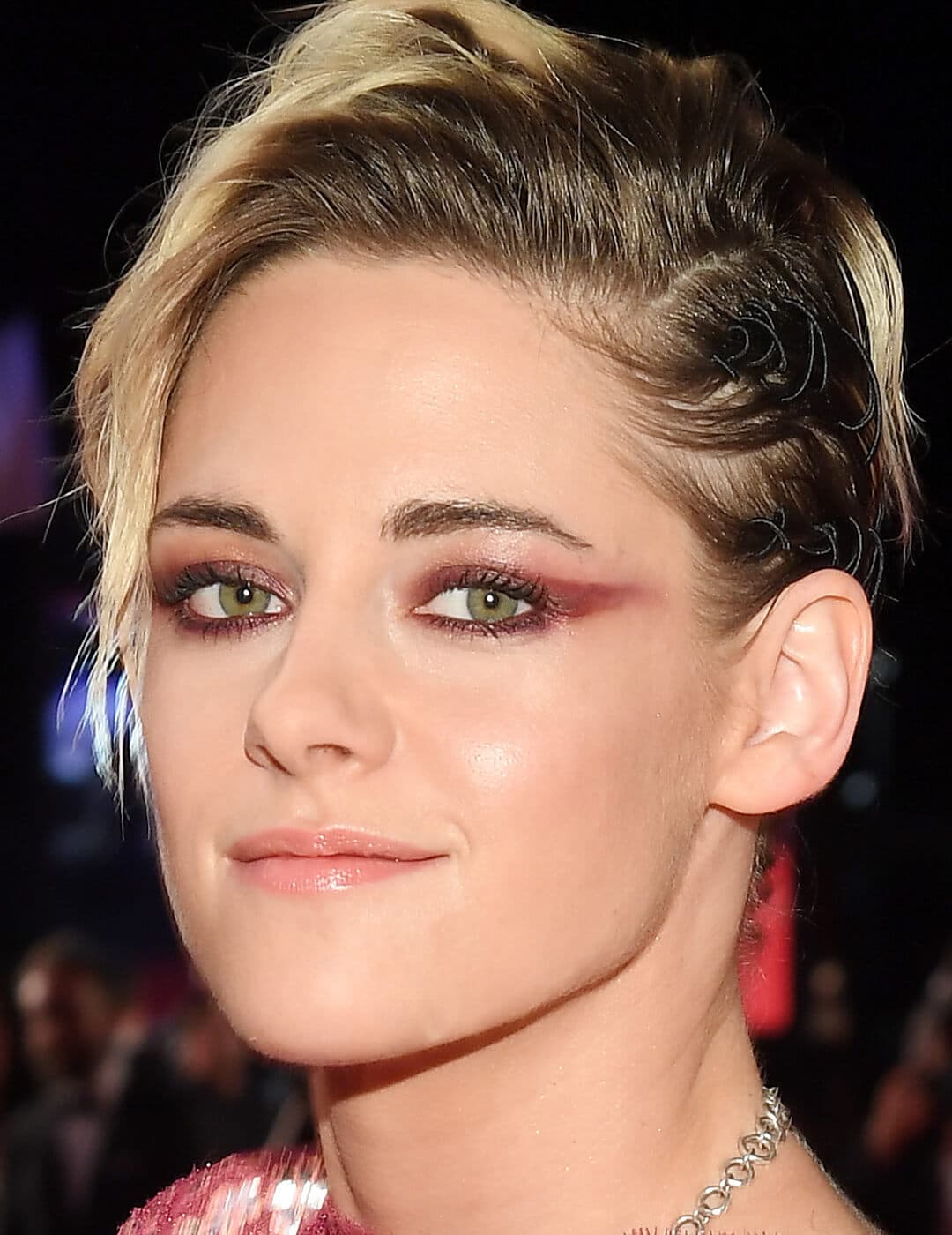 Close-up of Kristen Stewart rocking a rose eyeshadow and maroon cat-eye makeup look