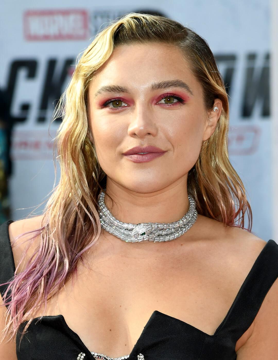 Florence Pugh rocking a wet look wavy hairstyle with dip-dyed ends