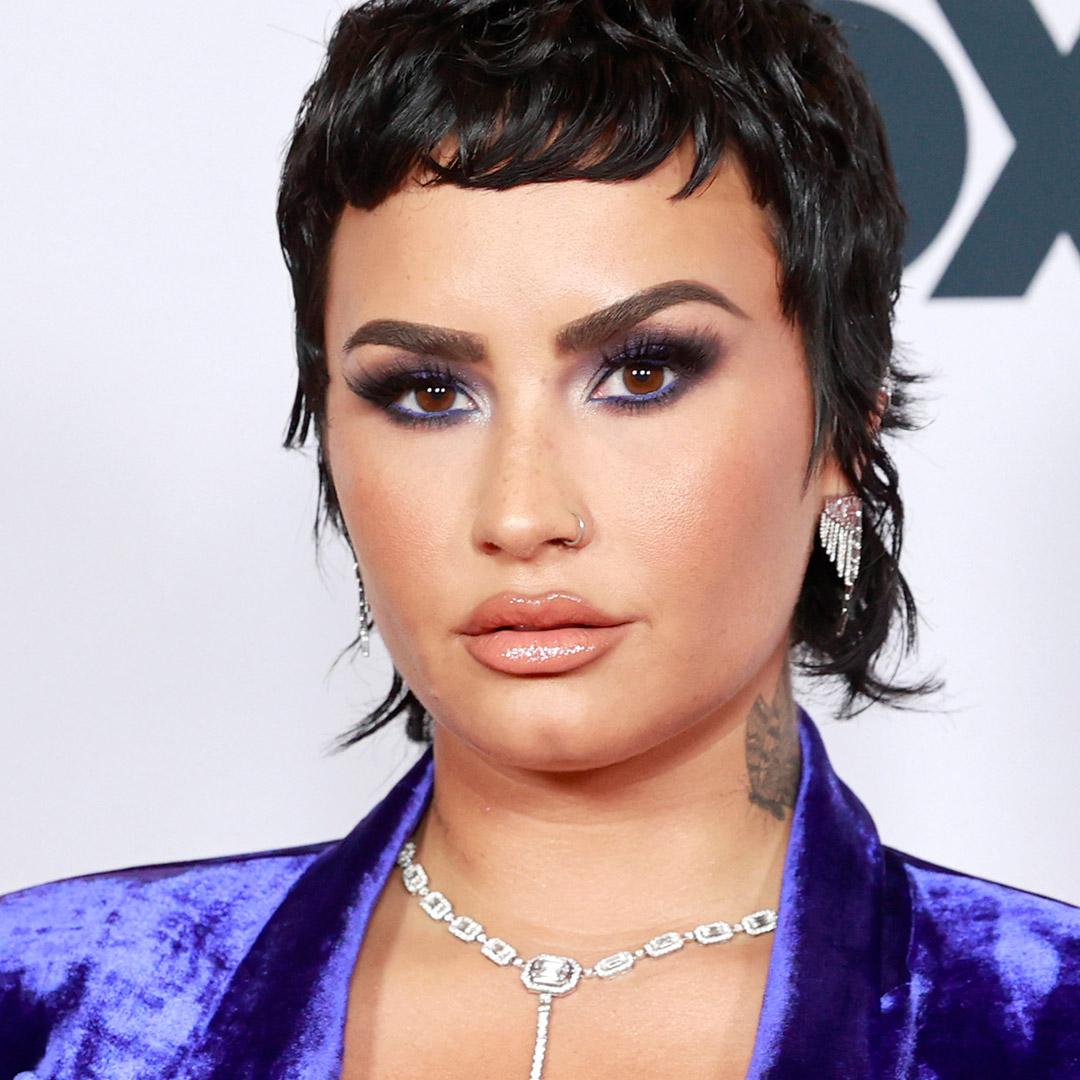 A photo of  Demi Lovato with playful baby bangs
