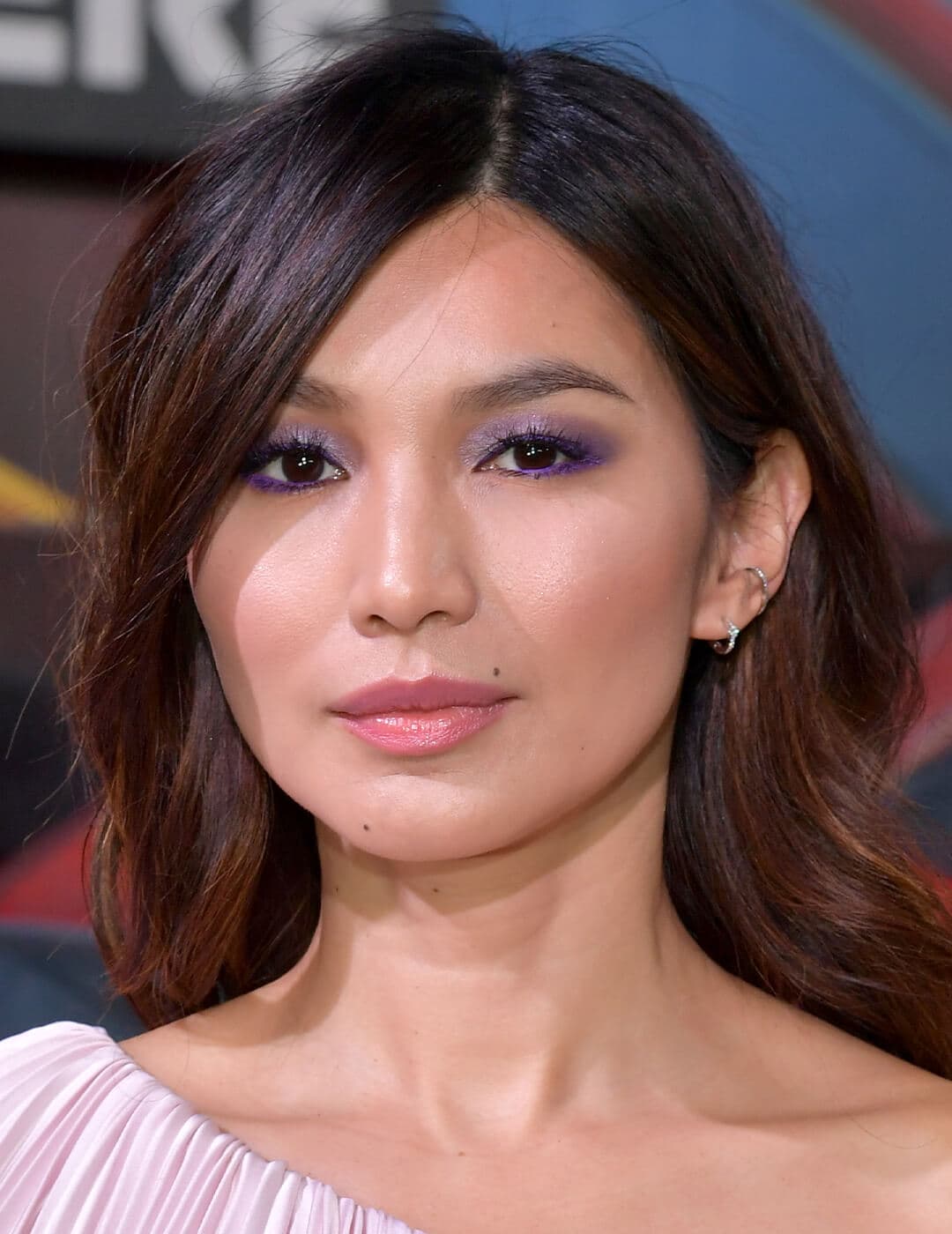 Gemma Chan rocking a lavender eye makeup look on the red carpet