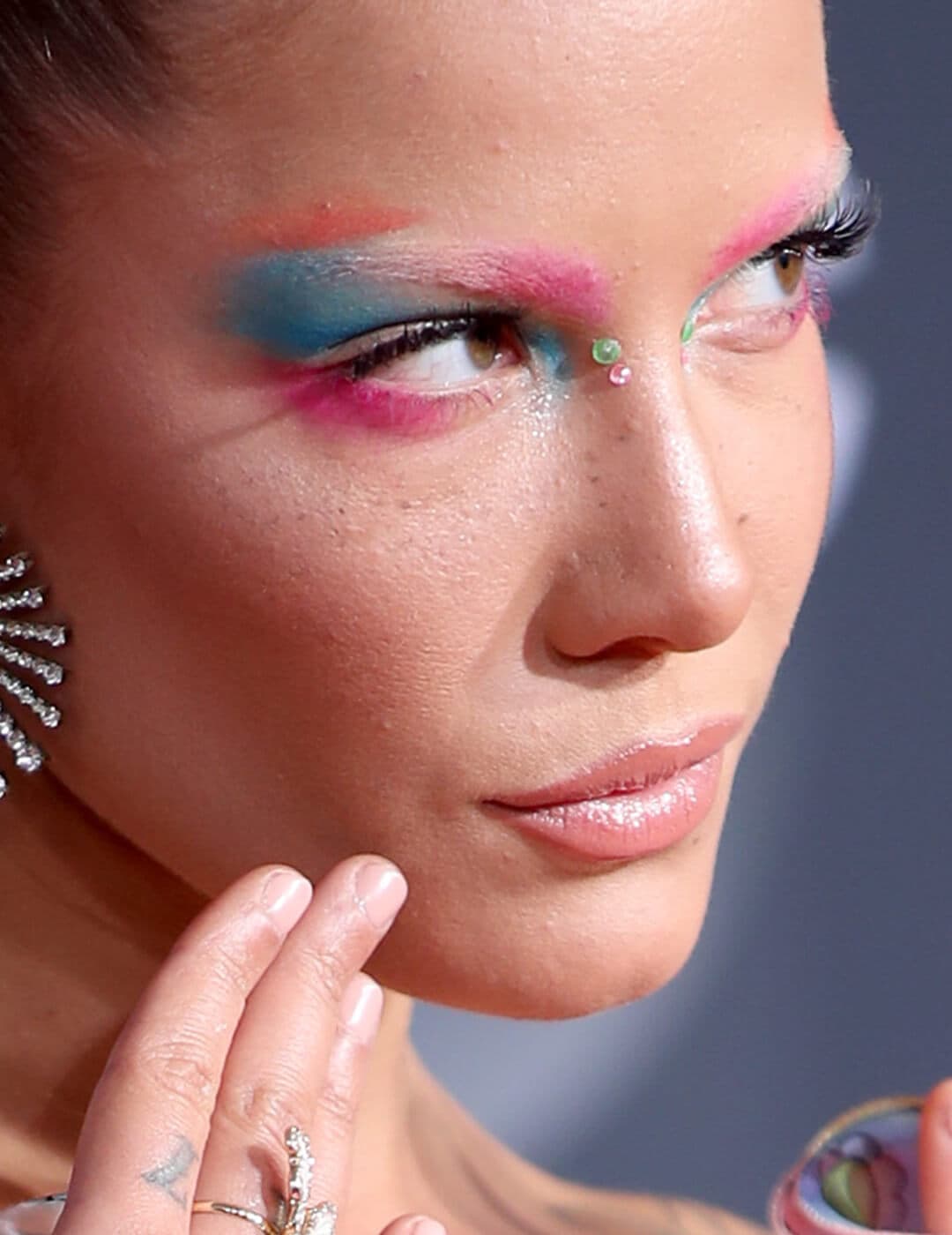 Close-up of Halsey rocking a neon pink and blue eyeshadow look