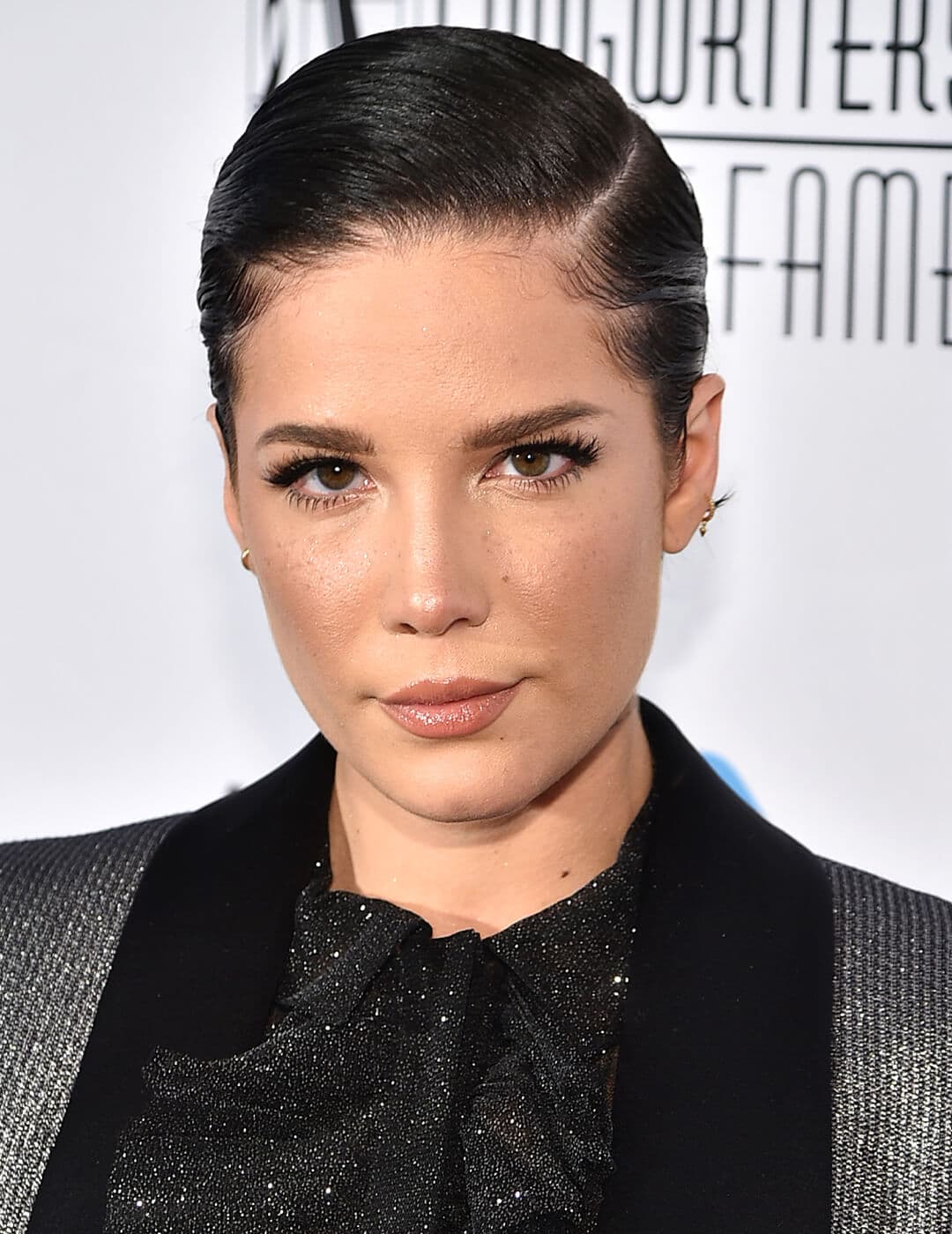 Halsey rocking a slicked-back pixie hairstyle and a no-makeup makeup look