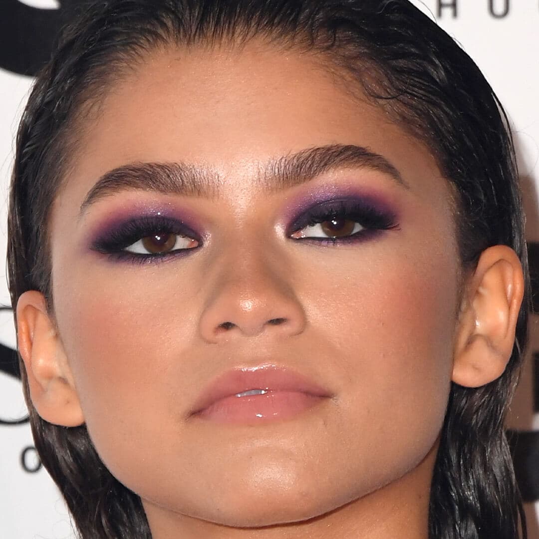 Close-up image of Zendaya rocking dark purple smokey eye look