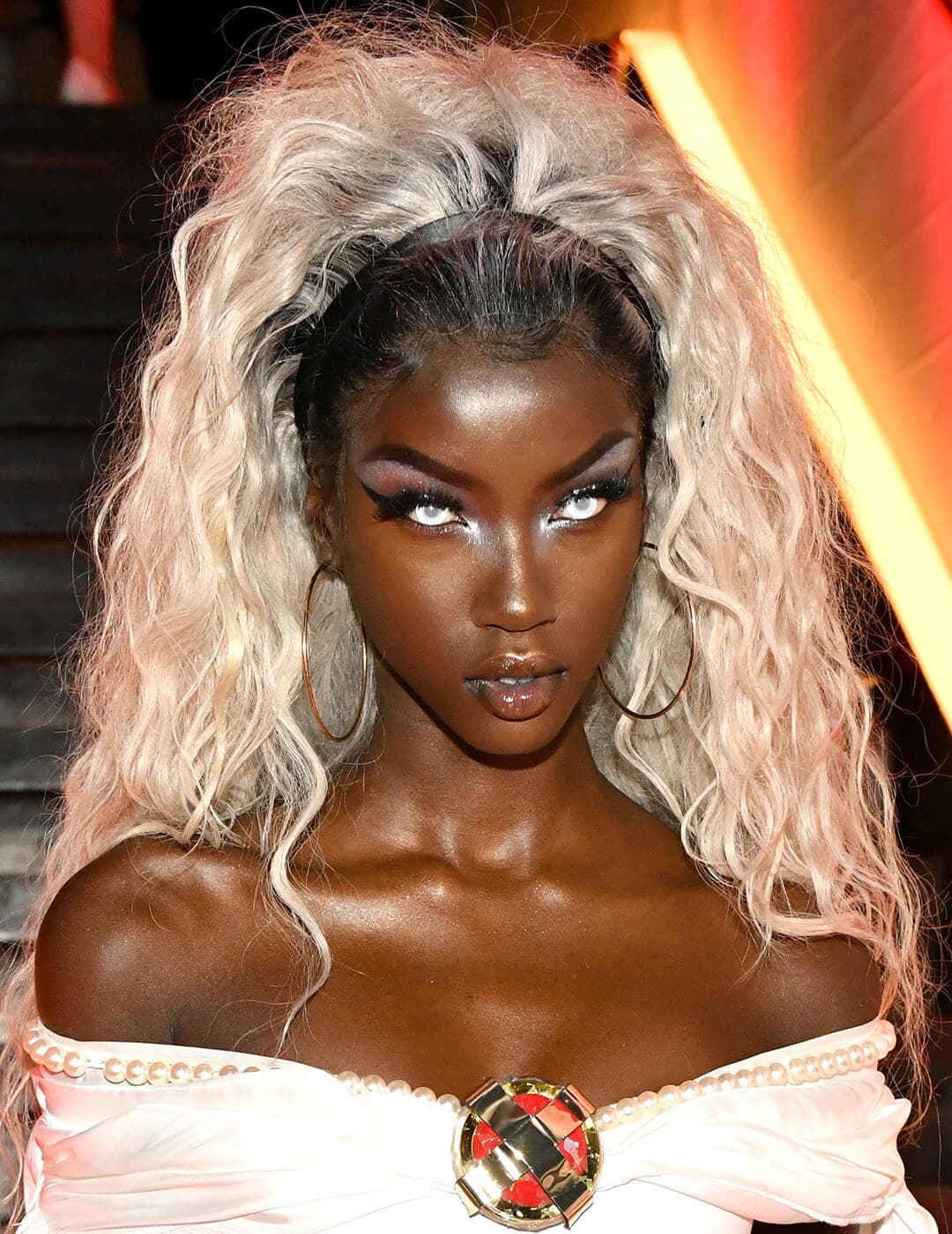 Anok Yai dressed and made up as Storm from X-Men for Halloween