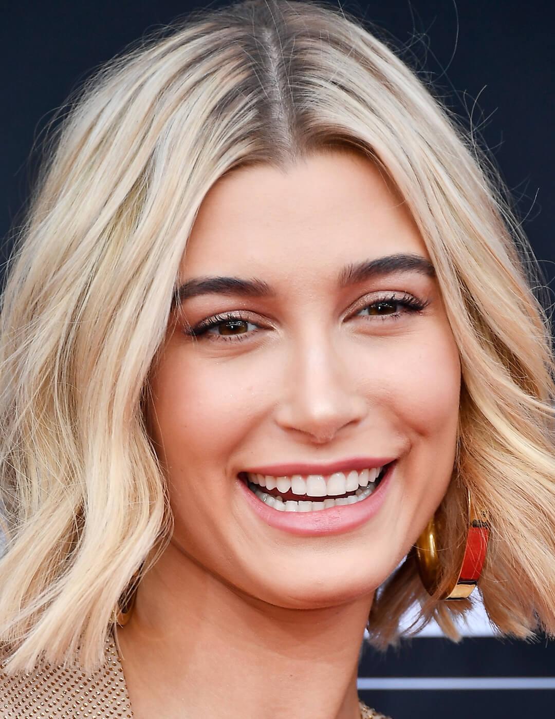 A photo of Hailey Bieber with a minimal makeup