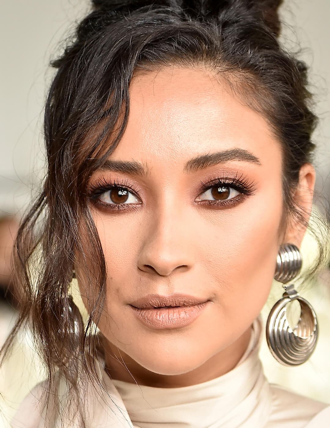 A closeup photo of  Shay Mitchell with a monochromatic makeup look