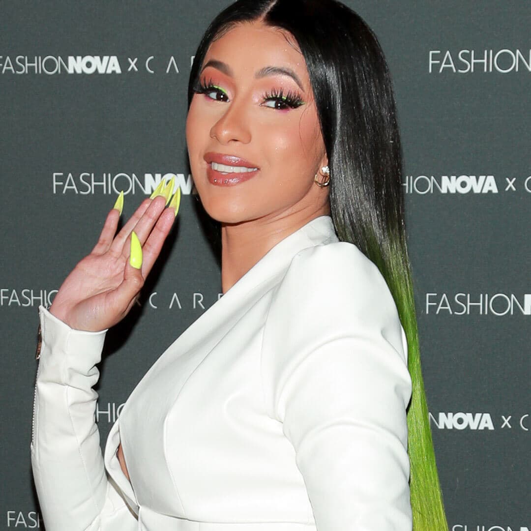 A photo of Cardi B with a pastel green ombre
