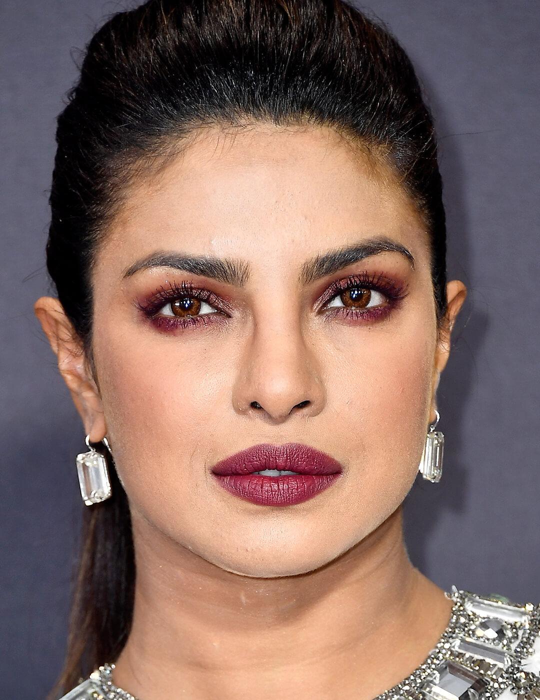 Close-up of Priyanka Chopra rocking a burgundy smoky eye makeup look