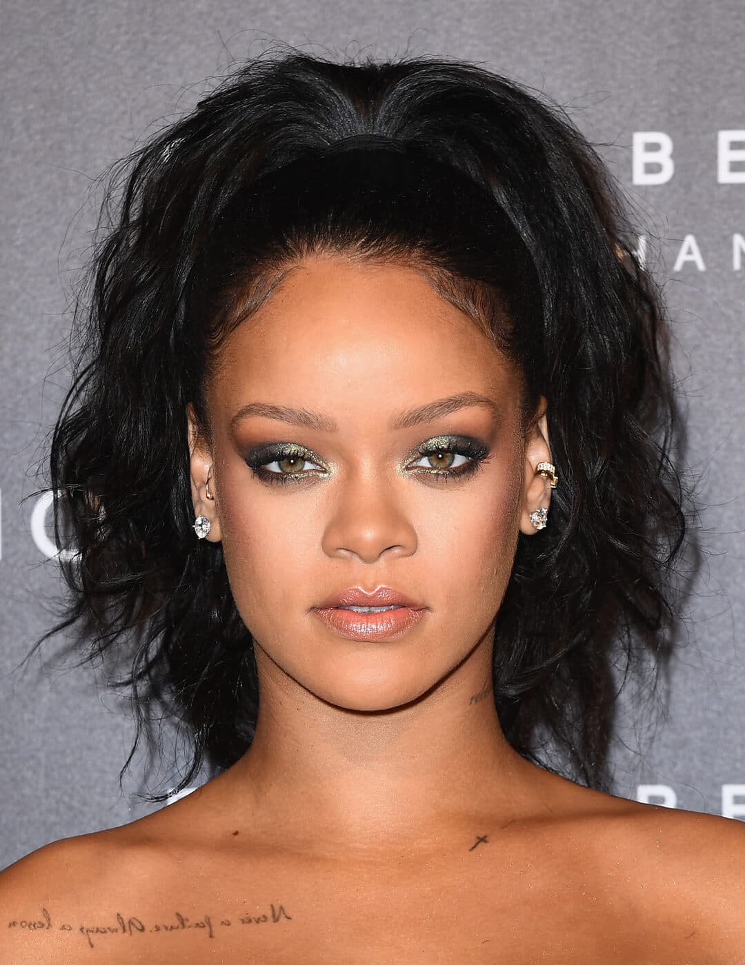 Rihanna looking glam in a smokey eyeshadow look and high ponytail hairstyle
