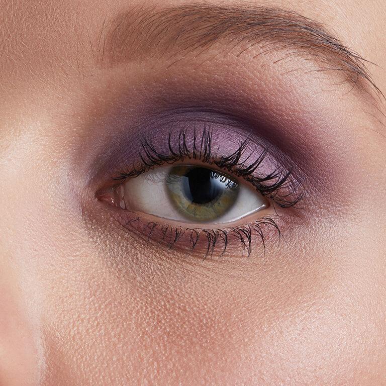 A closeup image of Hazel Graye's eye with a purple eyeshadow