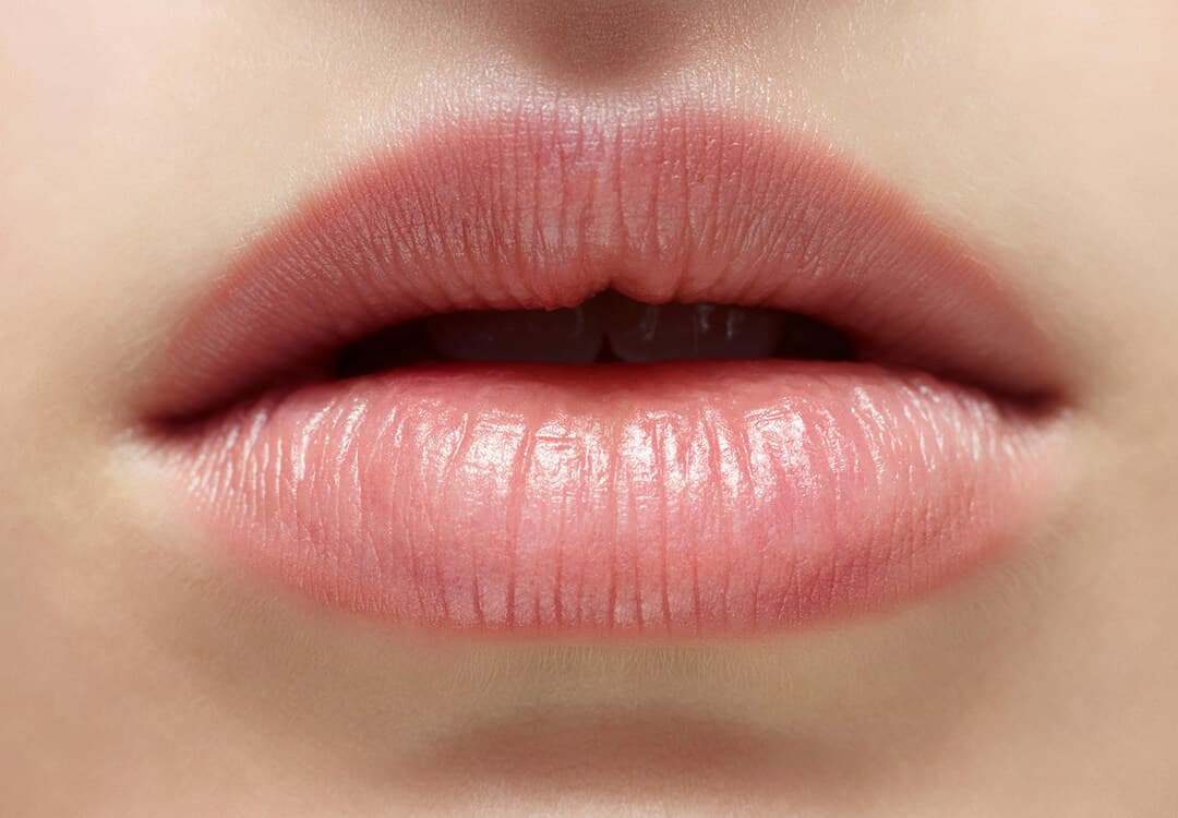 Close-up of a girl's downward turned lips