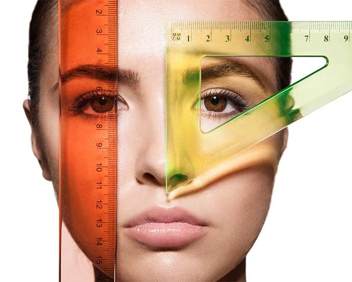 Closeup measure the woman's face and the shape of the eyes with rulers ...