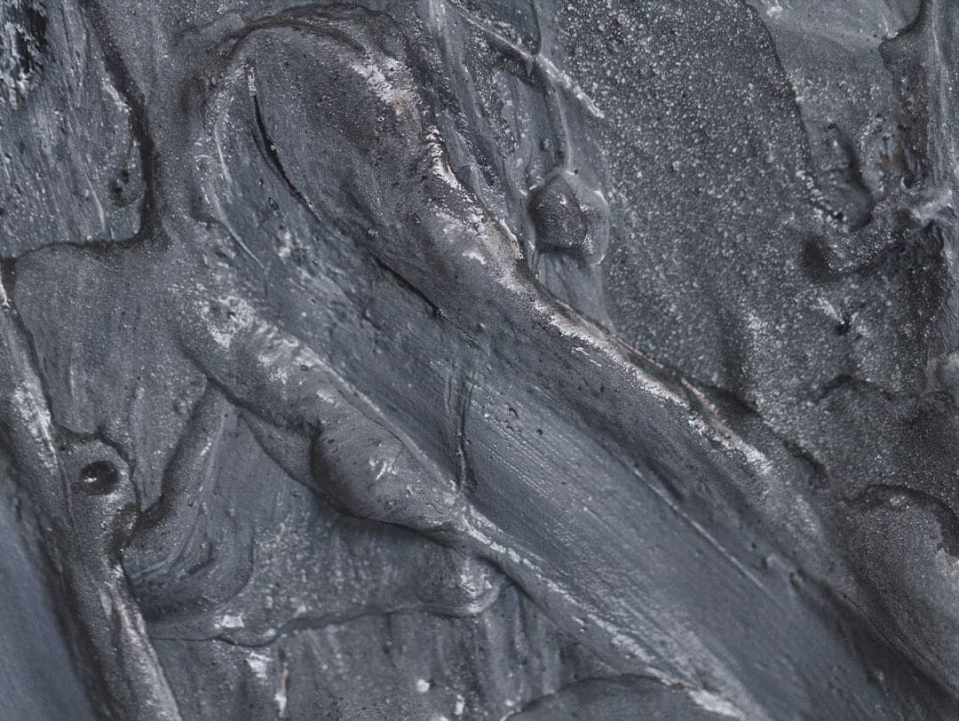 An image of a charcoalcolored blend of paint featuring a distinctive