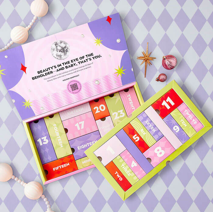 IPSY 2023 Beauty Advent Calendar open on a checkered background