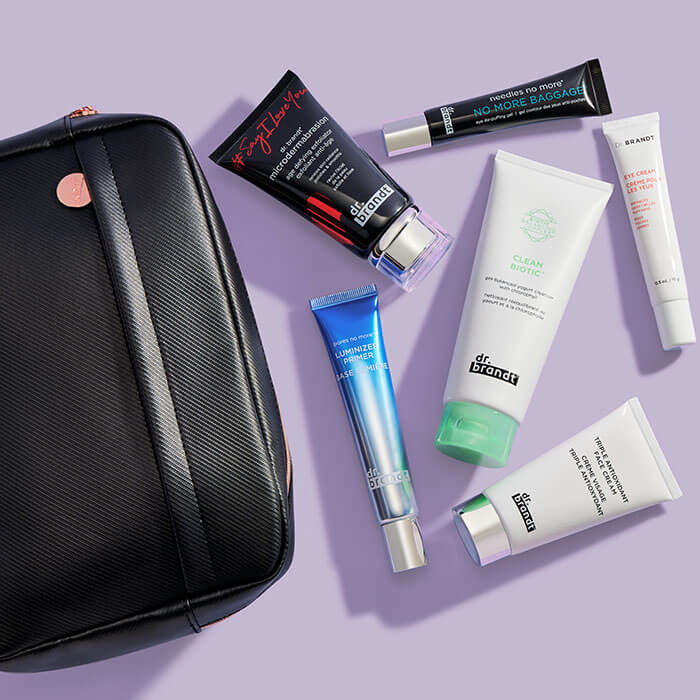 Black makeup pouch and skincare products from DR. BRANDT on lilac background