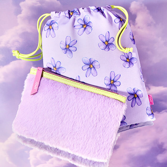 January 2023 IPSY Glam Bag and Glam Bag Plus bags on purple clouds background