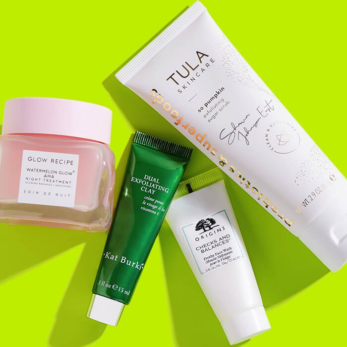 Skincare products from various brands on lime green background