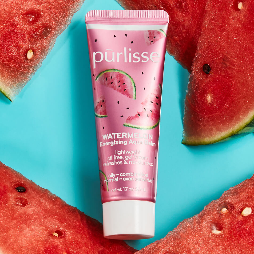 Image of PURLISSE Watermelon Energizing Aqua Balm and watermelon slices on an aqua blue surface