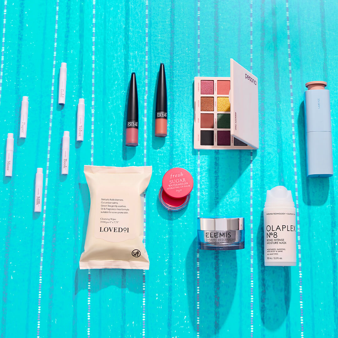Skincare and makeup products from various brands on a blue background