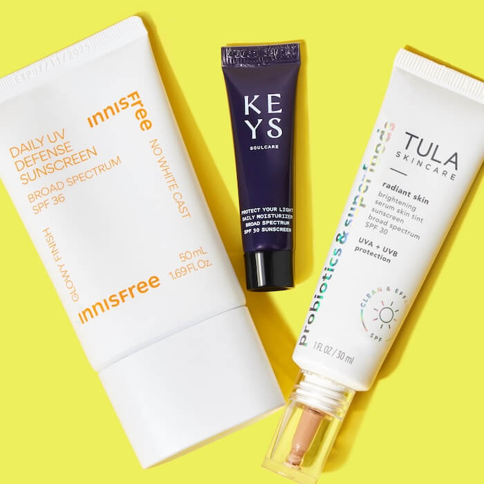Trio of best sunscreens over yellow background