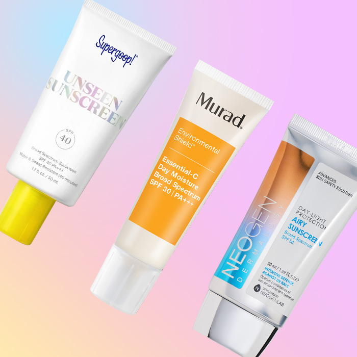 A flatlay of different sunscreen products on a pastel gradient background