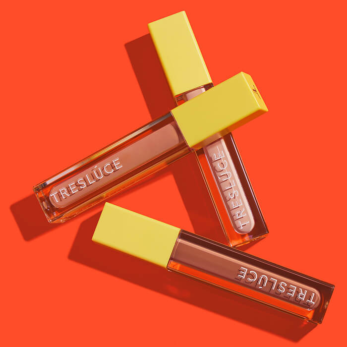 TRESLÚCE BEAUTY Se Preparó Eyelid Primer in various shades on dark orange background