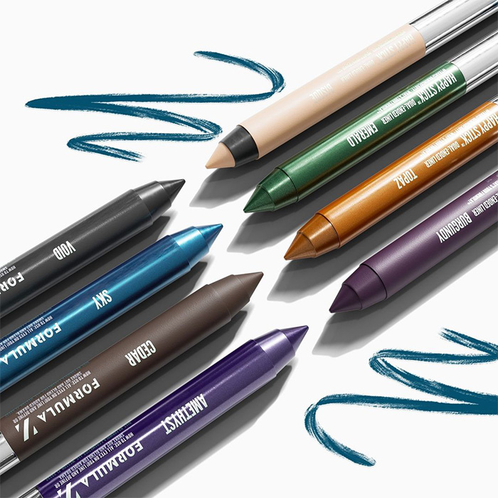 A closeup image of different colors of eyeliners with two swatches